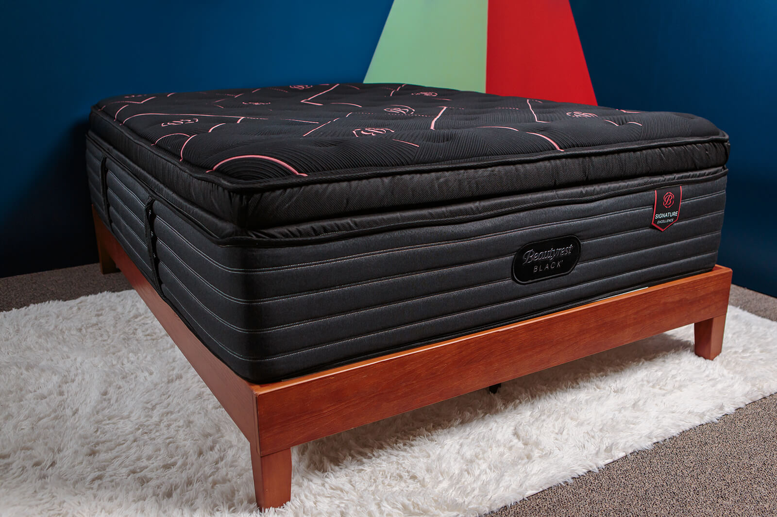 Photo of the Beautyrest Black Signature Mattress on a bedframe in a bedroom taken from a corner angle