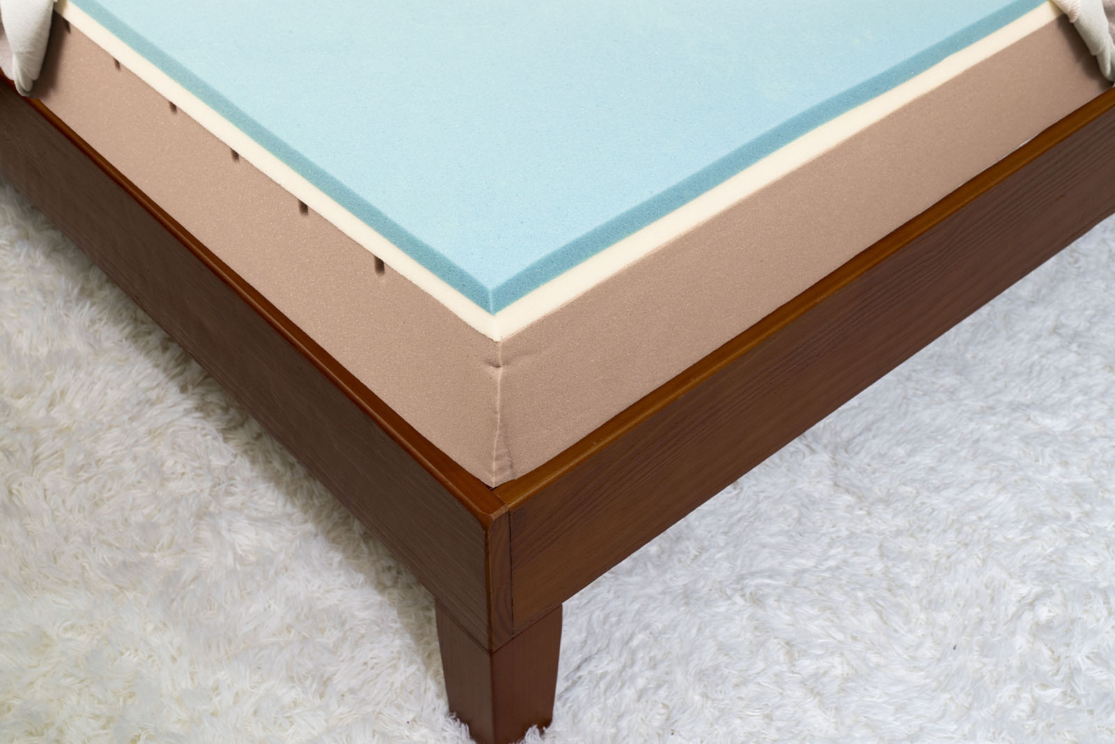 A photo of the Bloom Mist mattress layers without the mattress cover taken from a diagonal angle