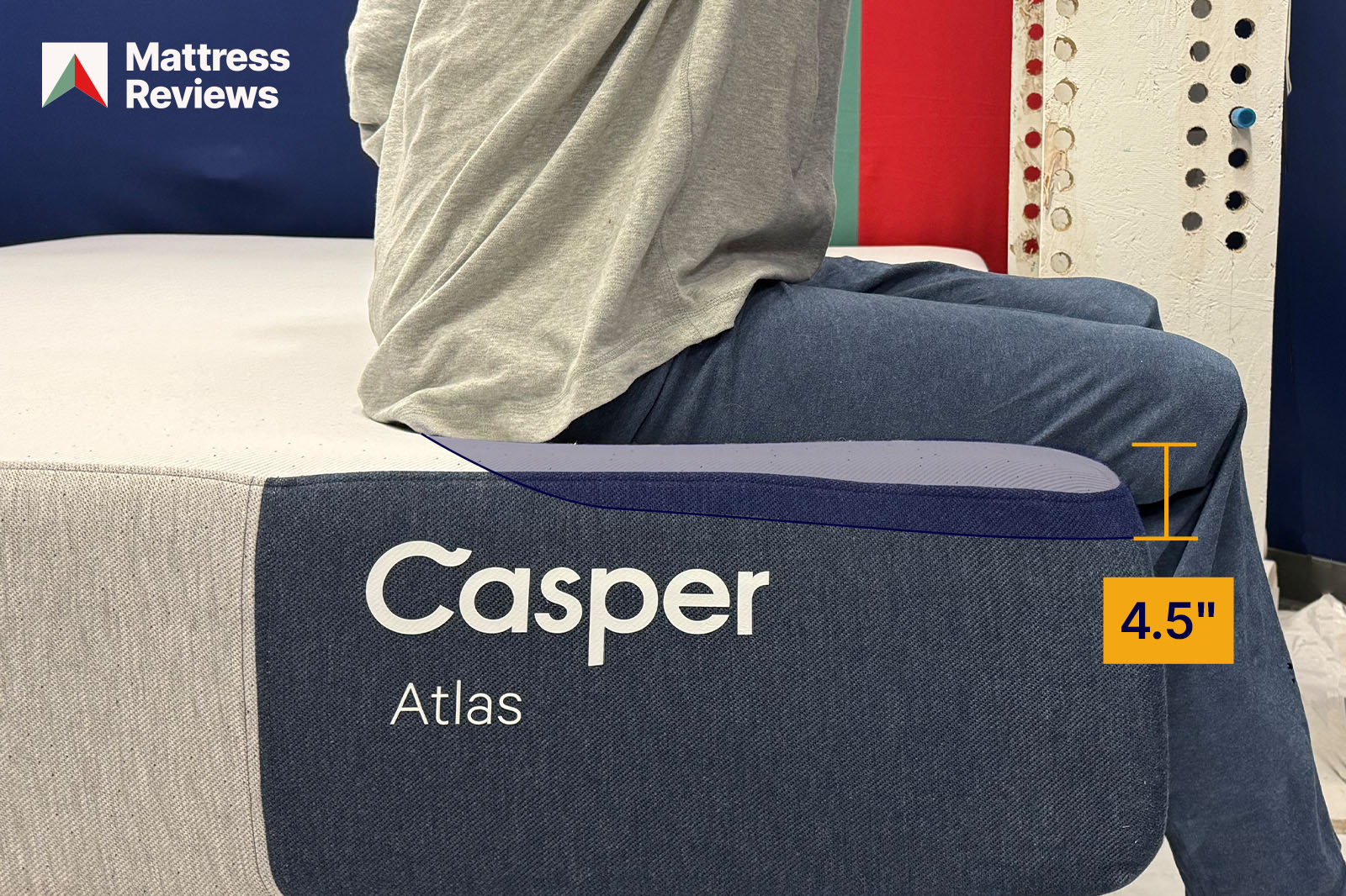 Image of a mannequin sitting on the edge of the Casper Atlas mattress leaving an impression that indicates the amount of edge support