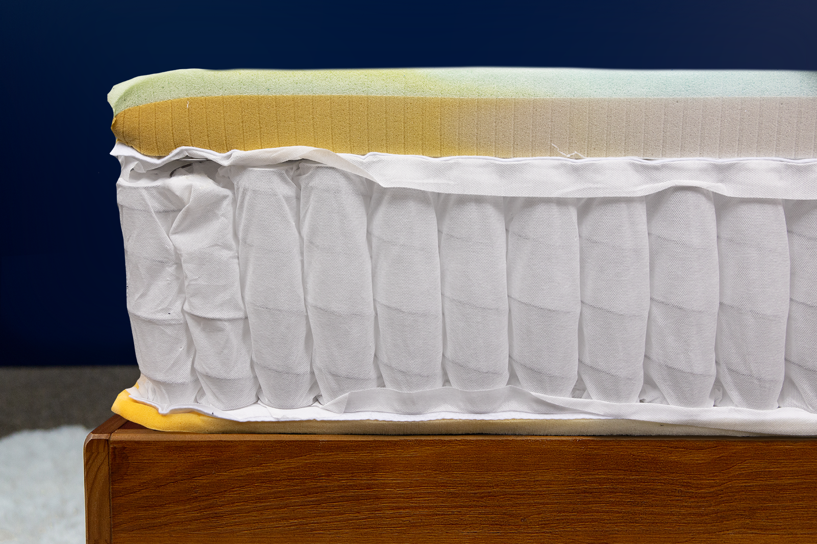 Photo of the DreamCloud hybrid mattress's internal layers taken from a front side angle