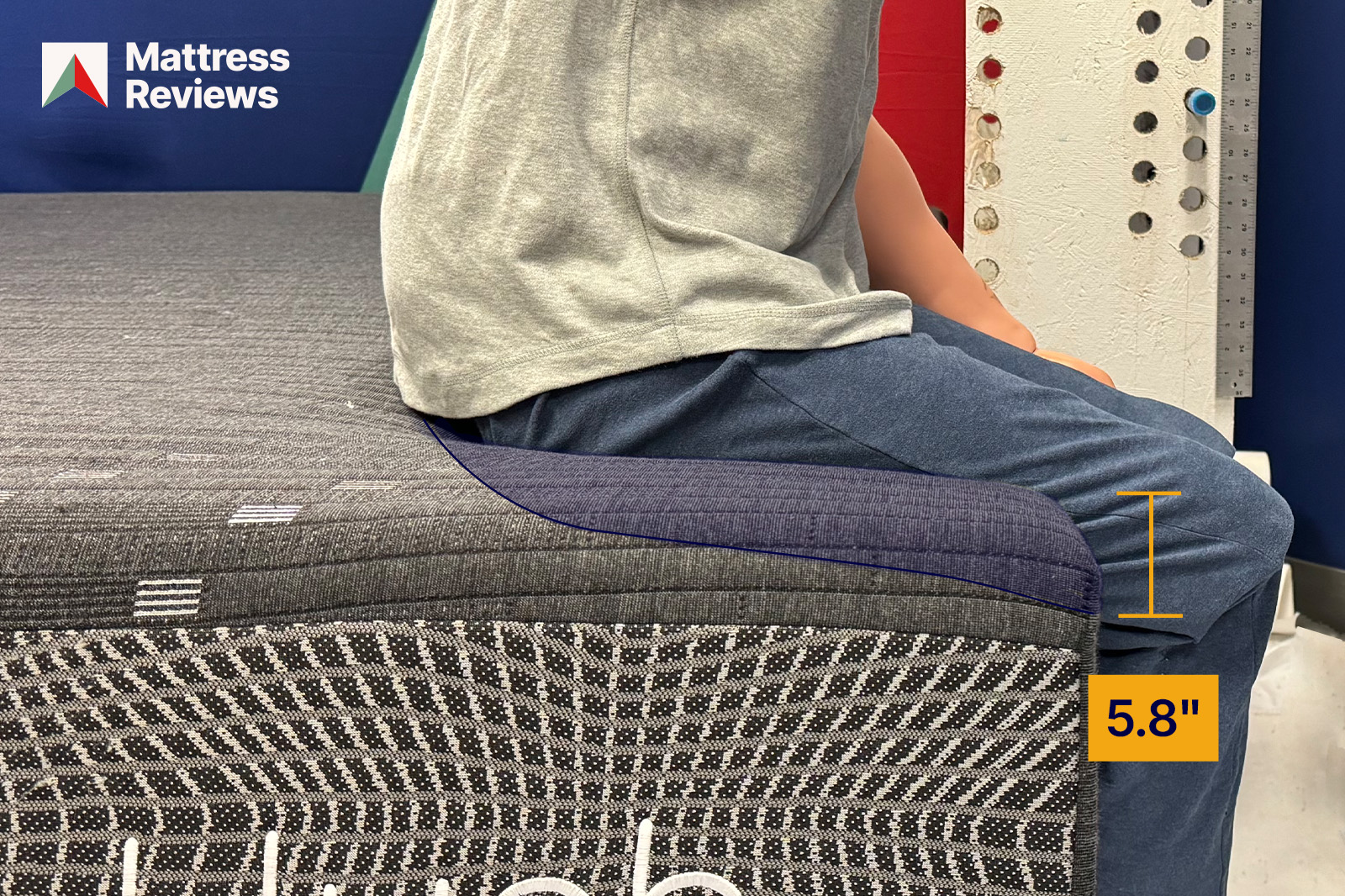 Image of a mannequin sitting on the edge of the Hush mattress leaving an impression that indicates the amount of edge support