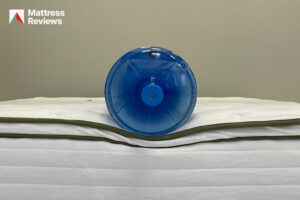 Photo of a water jug sitting on the edge of the Silk Snow Organic to demonstrate edge support
