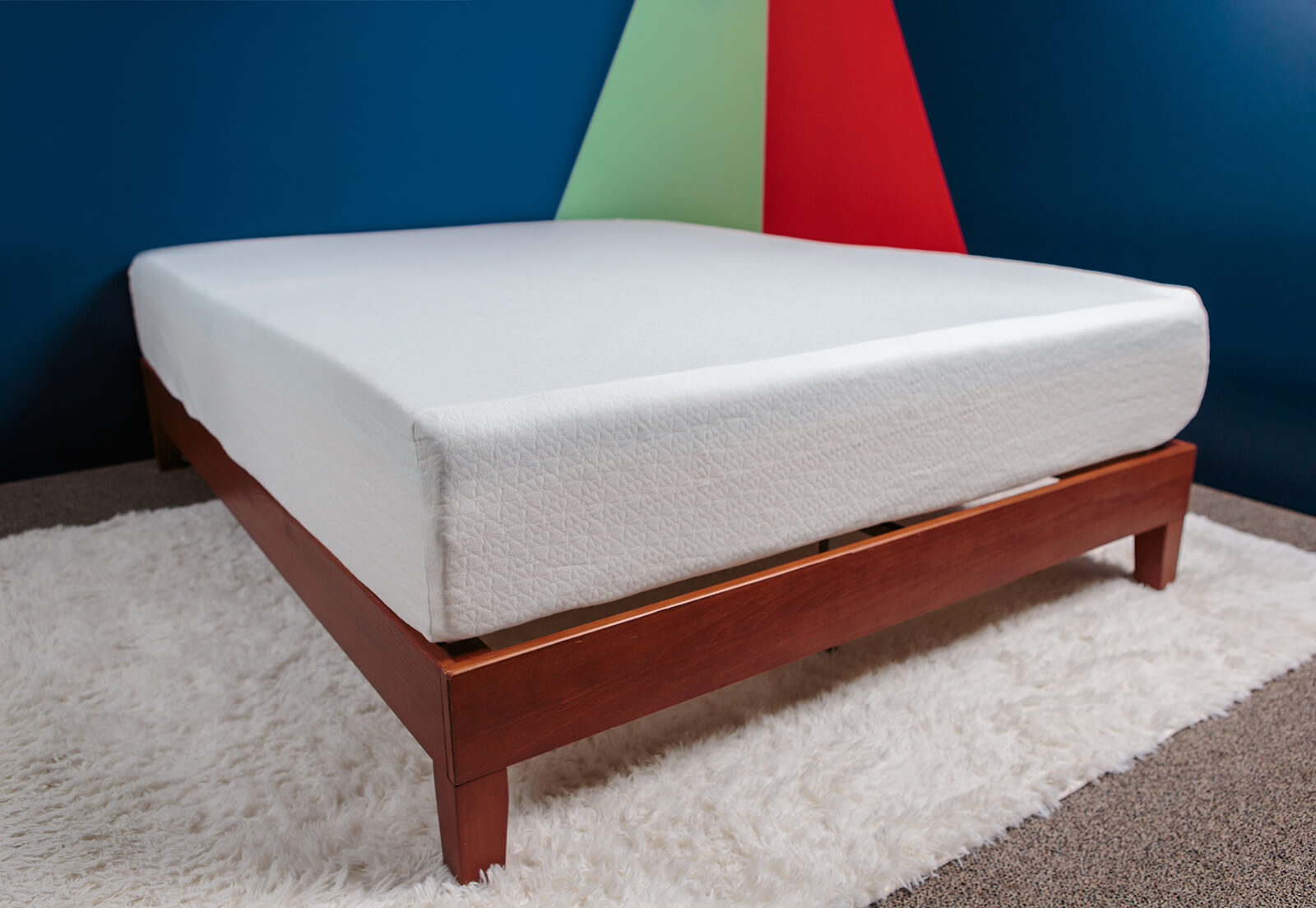 Diagonal view of the Zinus Green Tea mattress on a bed frame